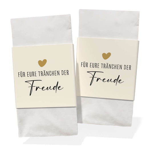 Banderole für Taschentücher zur Hochzeit mit goldenem Herz und Schriftzug 'Für eure Tränchen der Freude'.